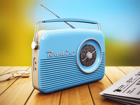 Old Radio On Wooden Table Outdoors