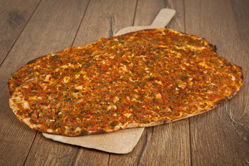 Turkish specialty pizza lahmacun pide with parsley and lemon