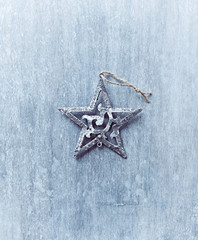 Rustic Christmas star on painted wood