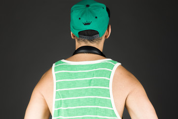 model isolated on plain background back hands on hips