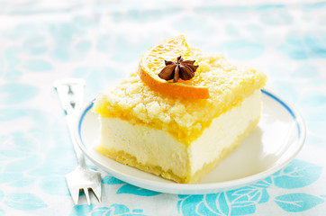 cake with orange, cream cheese and crumbs