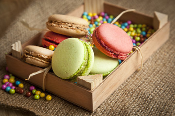 A lot of french colorful macarons with Turkish coffee