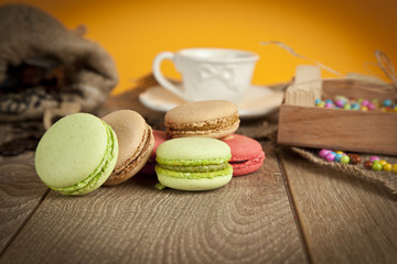 A lot of french colorful macarons with Turkish coffee