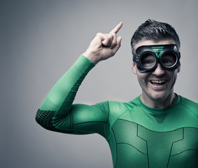 Happy superhero pointing up