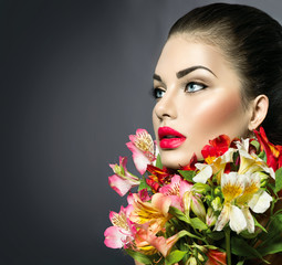 High fashion model girl with colorful flowers and red lips