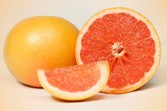Halved red grapefruit