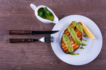 salmon steak grilled with sauce chimichurri
