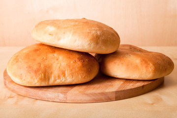 Homemade buns for breakfast on the board. Shallow depth of field