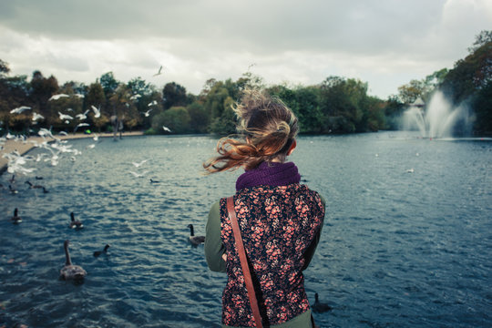 Woman looking at lake in a park