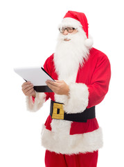 man in costume of santa claus with notepad
