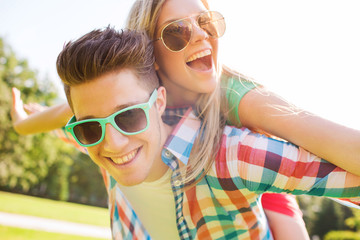 smiling couple having fun in park