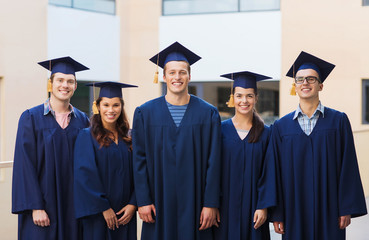 group of smiling students in mortarboards