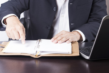 businessman opening his notebook