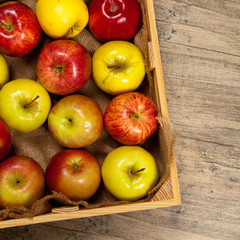 Wooden crate box full of fresh apples