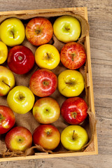 Wooden crate box full of fresh apples