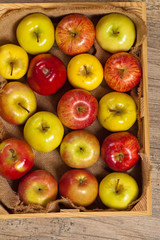 Wooden crate box full of fresh apples