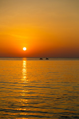 Decline at the sea a silhouette of the water motorcycle