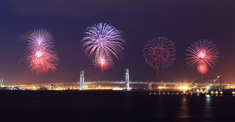 Fototapeta premium Fireworks celebrating over Yokohama Bay Bridge at night