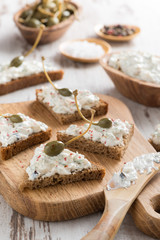 toasts with cheese pate and capers