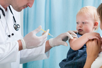 Little girl during medical vaccination