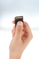Hand give SD card connection concept