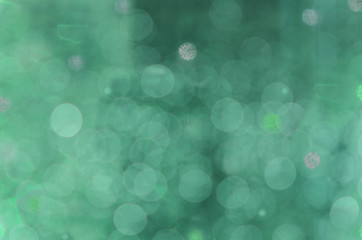 Abstract circular bokeh cold green background