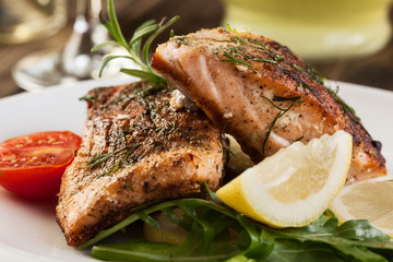 Fried salmon steak with vegetables
