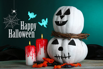 White Halloween pumpkins and candles