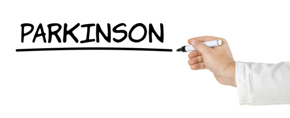 Hand mit Stift schreibt Parkinson