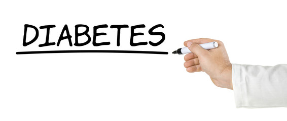 Hand mit Stift schreibt Diabetes