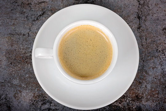 Cup of fresh coffee on table