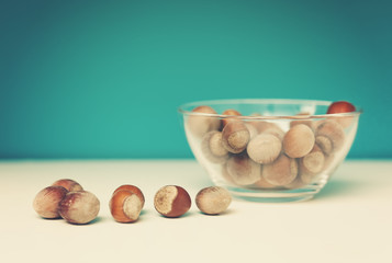 cup with hazelnuts, with a retro image toning