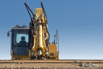 front close view of excavator on blue sky background