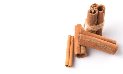Cinnamon sticks over white background
