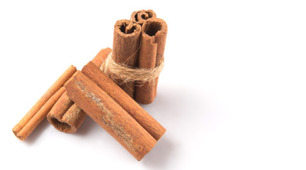 Cinnamon sticks over white background
