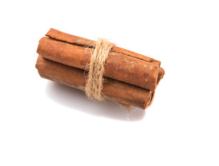 Cinnamon sticks over white background