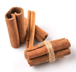 Cinnamon sticks over white background