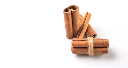 Cinnamon sticks over white background