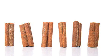 Cinnamon sticks over white background