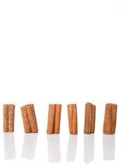Cinnamon sticks over white background