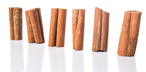 Cinnamon sticks over white background