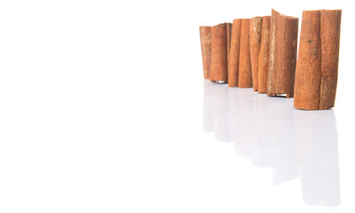 Cinnamon sticks over white background
