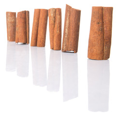 Cinnamon sticks over white background