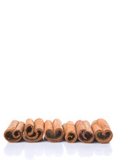 Cinnamon sticks over white background