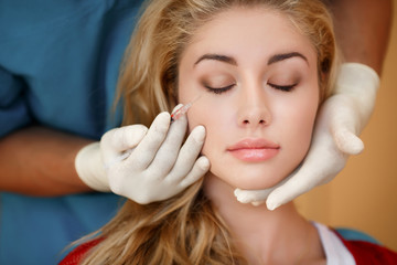 Woman receiving cosmetic injections