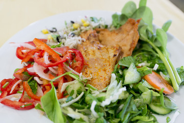 Chicken steak with vegetables on  plate