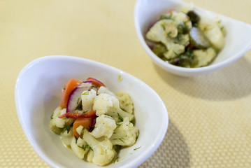 Vegetable salad with cauliflower in portioned plates