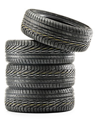 Four new black tires isolated on white