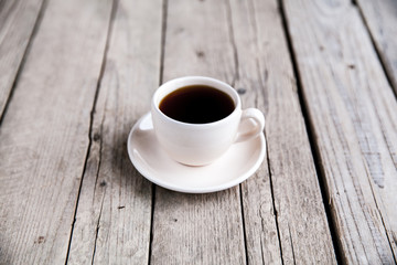 Obraz na płótnie Canvas cup of coffee on black background