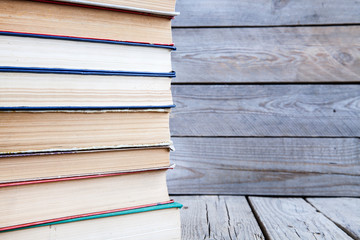 Old books on a wooden shelf.